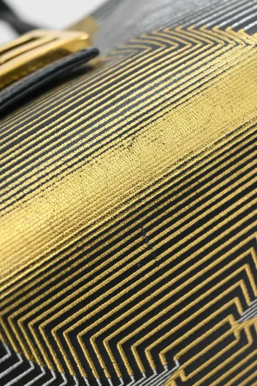 Black, silver, and gold leather shoulder bag with Zucca buckle magnetic snap closure