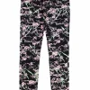Black skinny jeans with pink and green pattern