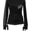 Black stretch-nylon corset style two-piece tracksuit featuring full-zip jacket and high-waist pants with side stripe and lace-up detailing
