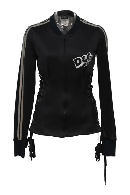 Black stretch-nylon corset style two-piece tracksuit featuring full-zip jacket and high-waist pants with side stripe and lace-up detailing