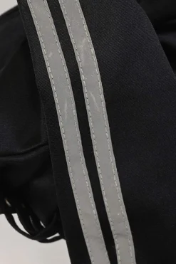 Black stretch-nylon corset style two-piece tracksuit featuring full-zip jacket and high-waist pants with side stripe and lace-up detailing