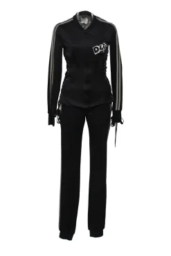 Black stretch-nylon corset style two-piece tracksuit featuring full-zip jacket and high-waist pants with side stripe and lace-up detailing