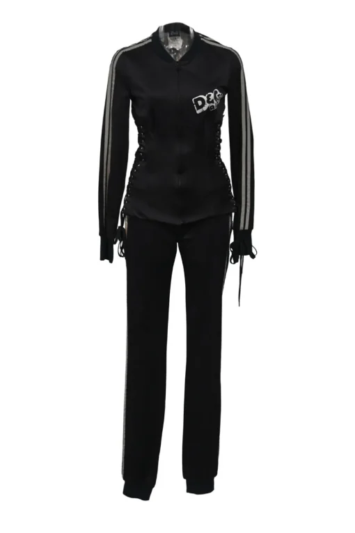 Black stretch-nylon corset style two-piece tracksuit featuring full-zip jacket and high-waist pants with side stripe and lace-up detailing