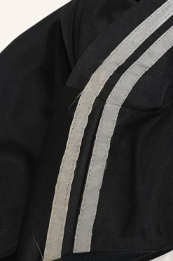 Black stretch-nylon corset style two-piece tracksuit featuring full-zip jacket and high-waist pants with side stripe and lace-up detailing