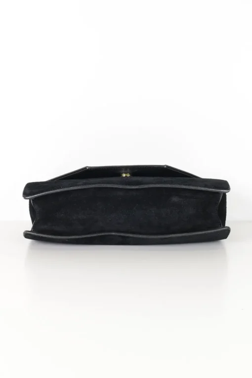 Black suede shoulder bag with gold tone chain and stitched corner fold up front detail