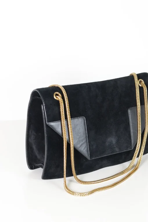 Black suede shoulder bag with gold tone chain and stitched corner fold up front detail