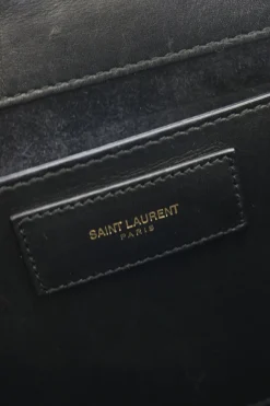 Black suede shoulder bag with gold tone chain and stitched corner fold up front detail