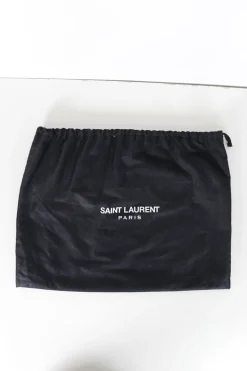 Black suede shoulder bag with gold tone chain and stitched corner fold up front detail