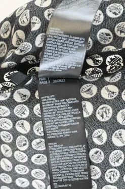 Black viscose landmark dot print pull-on high-rise midi slip skirt