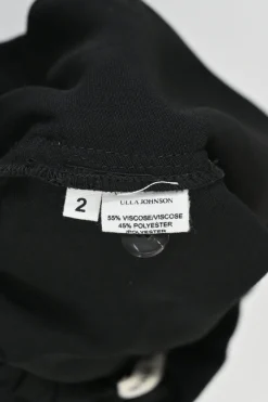 Black viscose-blend paperbag waist pull-on button-front tapered leg trousers