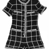 Black viscose-blend windowpane check fantasy tweed short sleeve romper with Coco Mark shank buttons