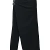 Black wool asymmetrical pants with wrap-front apron-style overlay