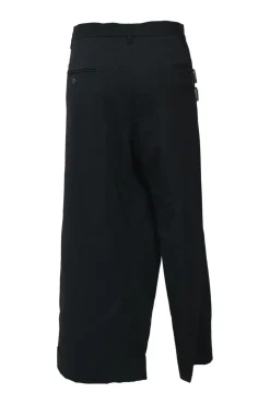 Black wool asymmetrical pants with wrap-front apron-style overlay