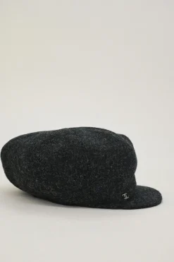 Black wool felt newsboy cap with metallic Coco Mark plaque appliqué