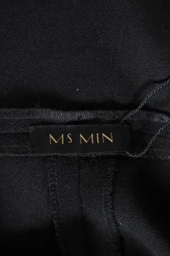 Black wool twill high-rise wide leg straight pants with wide waist band and pleats at front