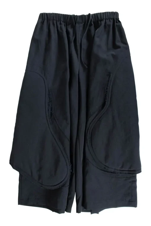 Black wool wide leg culottes in wool with  padded side panel cut outs. Elasticated waist with drawstring