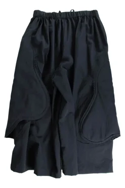 Black wool wide leg culottes in wool with  padded side panel cut outs. Elasticated waist with drawstring