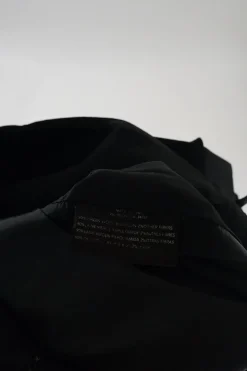 Black wool-blend apron-style wrap-effect A-line knee-length skirt