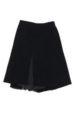 Black wool-blend boiled wool apron-style wrap-front skirt with semi-sheer raw edge plissé insert