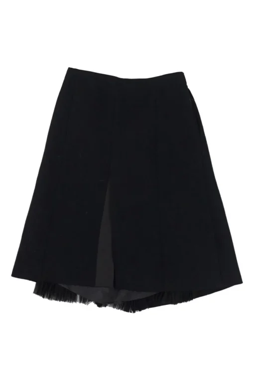 Black wool-blend boiled wool apron-style wrap-front skirt with semi-sheer raw edge plissé insert