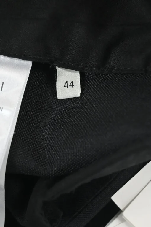 Black wool-mohair blend pull-on high-rise wide-leg tailored trousers with extended tab closure and turn-up cuffs