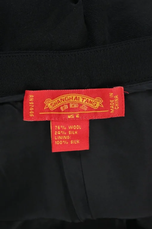 Black wool-silk blend pull-on low-rise flared tailored trousers