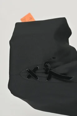 Black worsted wool pencil skirt with tonal velvet lace-up pleat detail