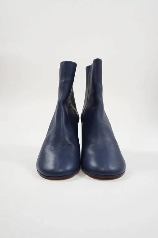 Blue calfskin pull-on round-toe zip-up ankle boots with cylindrical block heel and signature bar tack