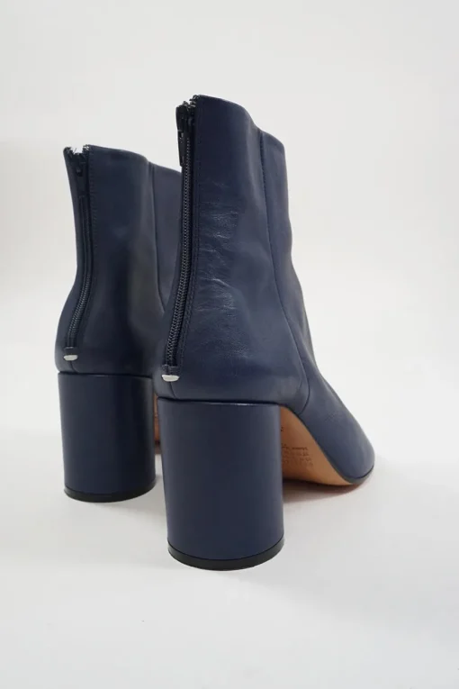 Blue calfskin pull-on round-toe zip-up ankle boots with cylindrical block heel and signature bar tack