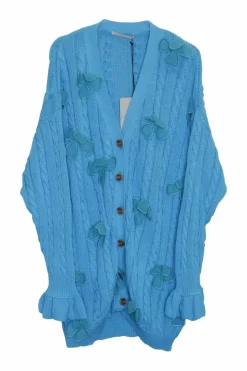 Blue cotton cable-knit button-front cardigan with flounce cuffs and tonal floral appliqués