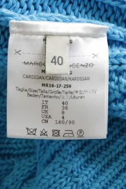 Blue cotton cable-knit button-front cardigan with flounce cuffs and tonal floral appliqués