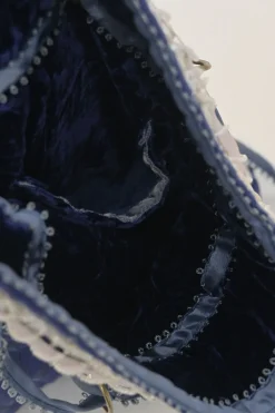 Blue embellished abstract jacquard drawstring shoulder bag with contrast bead broderie appliqué
