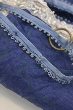 Blue embellished abstract jacquard drawstring shoulder bag with contrast bead broderie appliqué