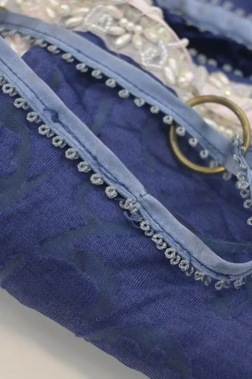 Blue embellished abstract jacquard drawstring shoulder bag with contrast bead broderie appliqué
