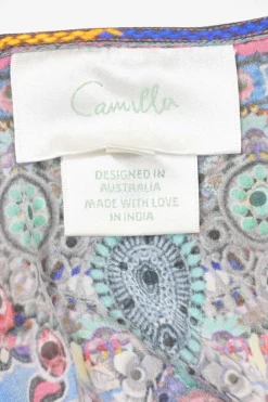 Blue embellished silk abstract print tie-waist blouson romper with racerback bodice and flared shorts