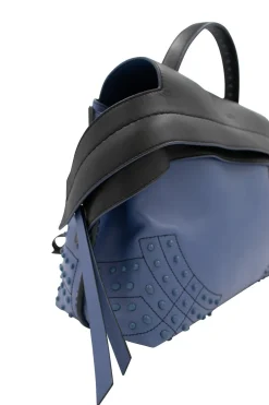 Blue leather bag with black flap and studs at corners, comes with shoulder strap