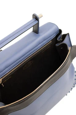 Blue leather bag with black flap and studs at corners, comes with shoulder strap