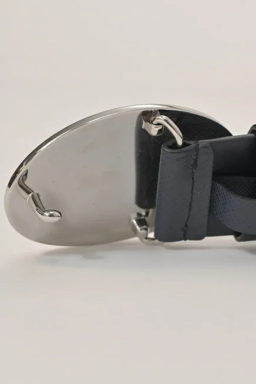Blue Saffiano leather belt featuring large silver-tone engraved logo