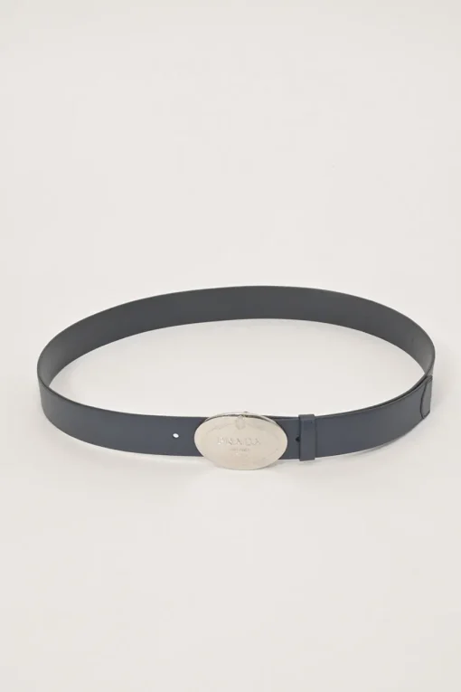 Blue Saffiano leather belt featuring large silver-tone engraved logo