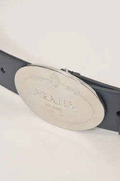Blue Saffiano leather belt featuring large silver-tone engraved logo