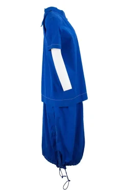 Blue short sleeve, buttoned down back, cotton top and knee length skirt with cargo pocket, drawstring details and stretch waist