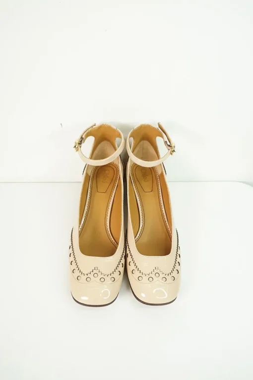 Blush brogued patent leather and leather block heel Mary Jane pumps with adjustable buckle ankle strap