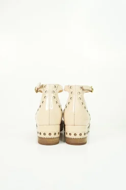 Blush brogued patent leather and leather block heel Mary Jane pumps with adjustable buckle ankle strap