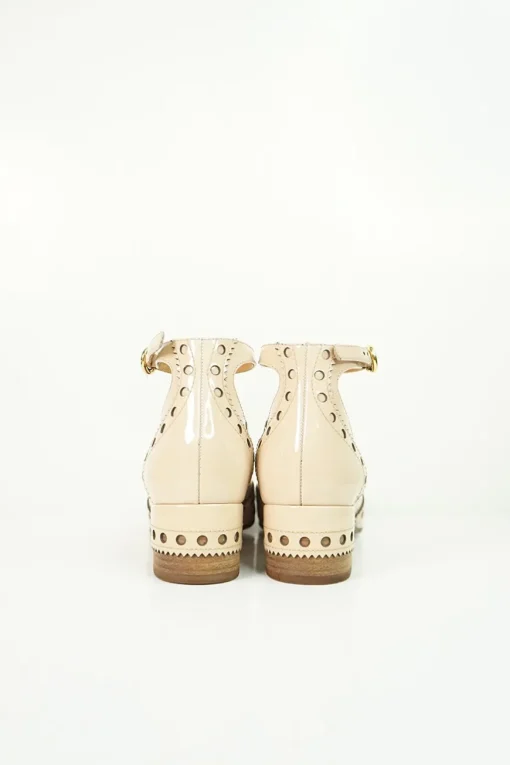 Blush brogued patent leather and leather block heel Mary Jane pumps with adjustable buckle ankle strap