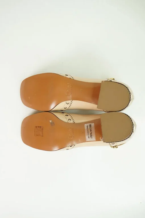 Blush brogued patent leather and leather block heel Mary Jane pumps with adjustable buckle ankle strap