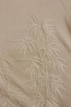 Blush cotton Qipao-style pullover cap sleeve knit top featuring bamboo broderie motif