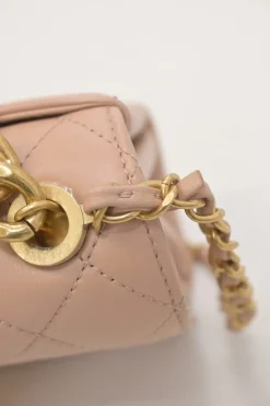 Blush matelassé calfskin mini pearl chain flap bag