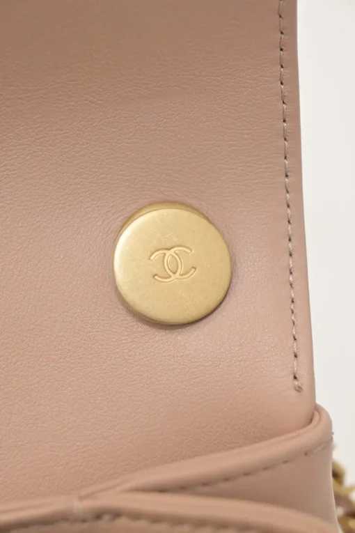 Blush matelassé calfskin mini pearl chain flap bag