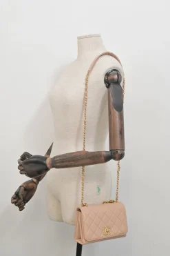 Blush matelassé calfskin mini pearl chain flap bag