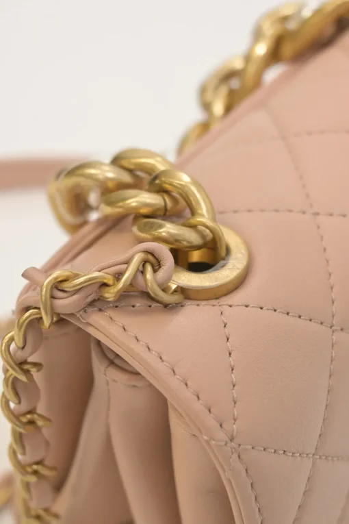 Blush matelassé calfskin mini pearl chain flap bag